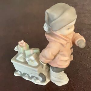 Kim Anderson Boy with sled full of presents